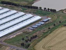 Drone flyover of broiler (meat) chicken farm - Captured at Pavilion Farm 6, Anakie VIC Australia.