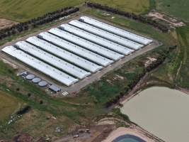 Drone flyover of broiler (meat) chicken farm - Captured at Pavilion Farm 6, Anakie VIC Australia.