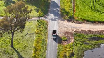 Knackery truck on road - Screenshots from drone footage showing the slaughter of ex-racing and breeding thoroughbreds and standardbreds. - Captured at Peter Loffel's Illegal Knackery, Mooroopna VIC Australia.
