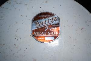 Meat saw inside processing room - Handheld photos taken at Goulburn Valley Stock Removers, owned by horse dealer Peter Loffel. Ex-racehorses are illegally killed on his residential property then transported to the knackery, where they are processed into pet food. The knackery also processes dead cows, mainly dairy cows. - Captured at Goulburn Valley Stock Removers, Shepparton North VIC Australia.