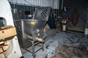 Mincer inside processing room - Handheld photos taken at Goulburn Valley Stock Removers, owned by horse dealer Peter Loffel. Ex-racehorses are illegally killed on his residential property then transported to the knackery, where they are processed into pet food. The knackery also processes dead cows, mainly dairy cows. - Captured at Goulburn Valley Stock Removers, Shepparton North VIC Australia.